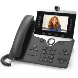 Cisco 8865 IP video phone on office desk with handset and display on
